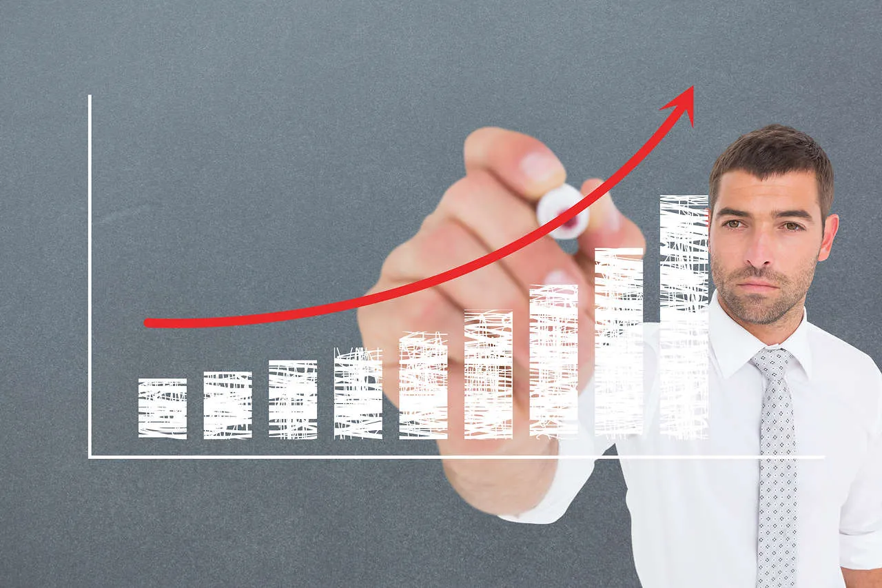 Executivo analisando gráfico de crescimento dos consórcios em 2026